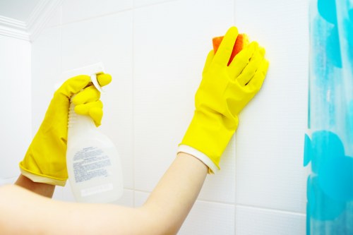 Team member completing carpet cleaning duties with health and safety precautions